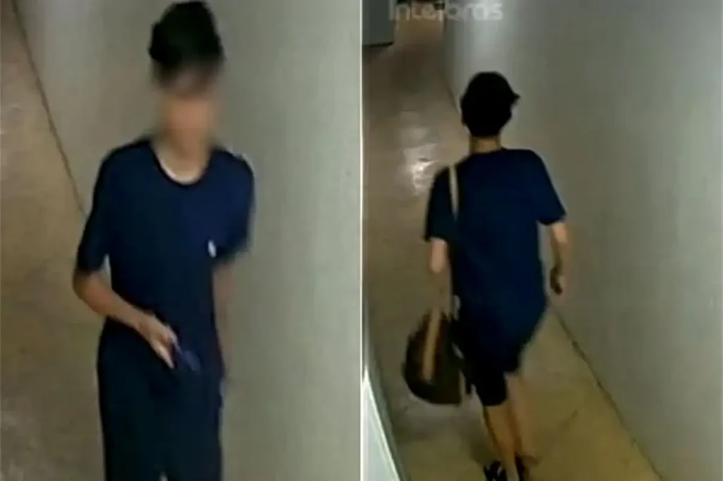 Imagem de segurança do adolescente usando camisa e bermuda azul saindo do prédio