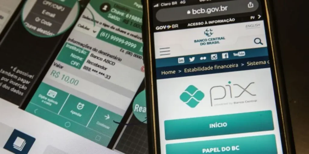 símbolo Pix com alerta de segurança, representando ataque hacker e suspensão de serviço.
