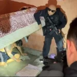 suspeito escondido embaixo de cama