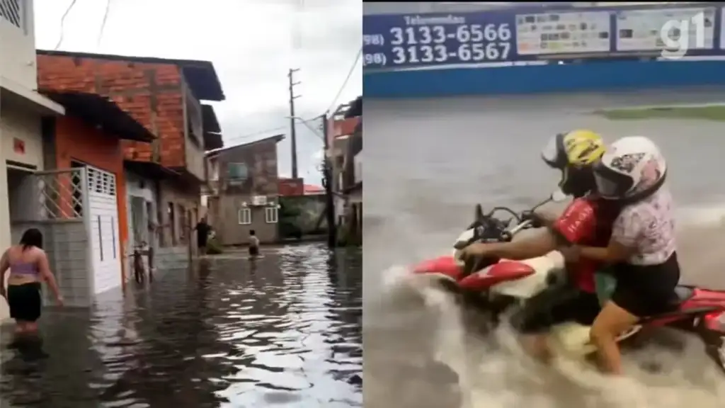 Temporal alaga são luís: Pessoas em rua alagada e moto atravessando enchente